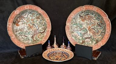 Pair of large Meiji Period Imari chargers on stands, (17" diameter) a smaller charger, (12,5"