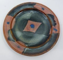A Ray Finch (1914-2012) studio pottery charger / plate. Impressed mark for Ray Finch for