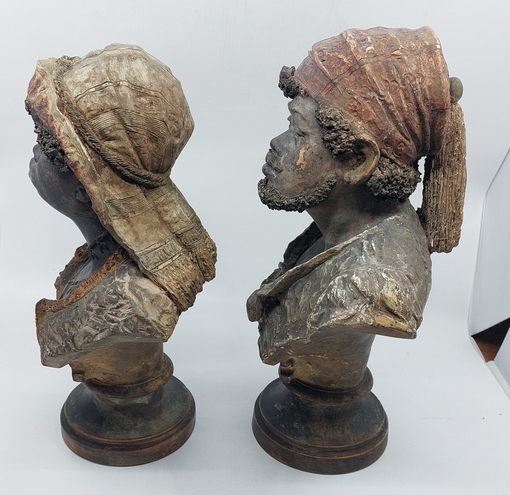 A pair of Goldscheider cold painted terracotta portrait busts of an Arab man and woman on stepped - Image 4 of 4