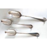 A set of three George I Irish silver Hanoverian pattern dessert spoons with rat tail bowls by Thomas