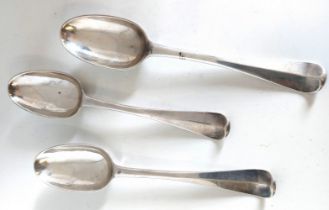 A set of three George I Irish silver Hanoverian pattern dessert spoons with rat tail bowls by Thomas