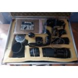 A Nikon FM camera, Nikon MDII standard lens, telephone lenses-Tamron 8210, Vivitar 35mm,