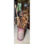 Ceramic Stick stand  with decorated plaque detailing fish. contents over 30 sticks, canes and