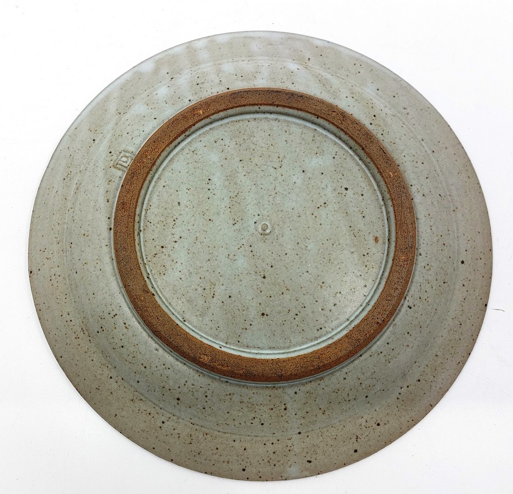 A David Leach (1911-2005). Stoneware plate, impressed mark DL. measuring 27cm across Condition: - Image 2 of 3