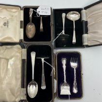 A Victorian silver spoon and pusher with foliate scroll handles, another Birmingham 1927 and two