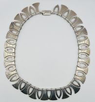 A designer sterling silver collar necklace, hallmarked Birmingham, 2000, for TT Co. Marked for