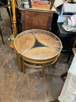 Nest of four tables , three teak elliptical tables under glass topped and teak framed table.