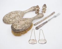 A collection of silver. Comprising an Edwardian weighted hair brush and mirror and the covering