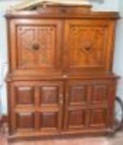 A Victorian mahogany and burr walnut inlaid hall cupboard, shaped pediment with carved rose roundel,