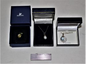 A selection of jewellery - to include a Swarovski pendant and a 925 stamped silver lipstick holder