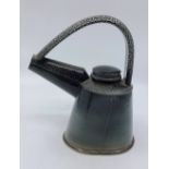 A Walter Keeler (born 1942). Salt-glazed stoneware extruded lidded teapot with crest handle. with an