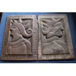 A pair of stylised relief carved oak Romayne heads of a male and female, each 43.5cm x 30.5cm