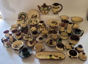 Large collection of Torquay wares , to include motto ware , teapots , candle holders , dishes ,