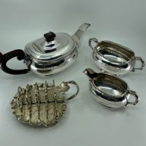 A three piece silver plated tea service with Lindisfarne band and a Hukin and Heath plated four