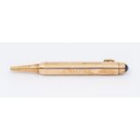 A 9ct gold Asprey propelling pencil, Set with a pale blue cabochon of sapphire. Stamped with