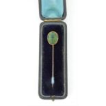 Early 20th century 15ct gold stick pin set with a scarab beetle, presented in a period leather box