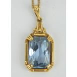 18ct gold emerald cut topaz pendant and 18ct gold chain.