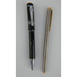 A Mont Blanc black ballpoint pen and a Mont Blanc slimline stainless steel Noblesse fountain pen