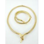 18ct gold coiled serpent sprung necklace and matching bracelet with inset ruby eyes