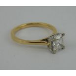A 1.2ct solitaire diamond ring featuring an old cut cushion central stone