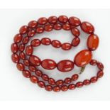 Large cherry amber coloured bead necklace, 75cm long, 73 grams