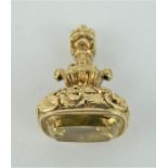 A fine antique yellow metal fob seal set with an emerald cut yellow spinel. Stone 15mm x 12mm.