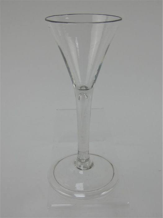 An 18th century drinking glass with trumpet bowl, tear drop stem and folded foot. Height 15.5cm - Image 4 of 6