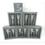 Five pairs of Waterford crystal Millennium champagne flutes and a Millennium champagne coaster