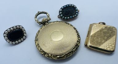 A collection of antique sentimental jewellery. Comprising a watch case style memorial locket in