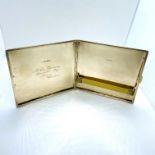 A cigarette case in 9ct gold with engine turn pattern. Initial AV for Arthur Venmore engraved to the
