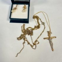 A collection of 9ct and yellow metal jewellery comprising a 9ct crucifix (approximate weight 1.3