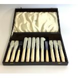 A cased Mappin and Webb plated fish knife and fork set