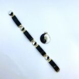 An onyx and mother of pearl yin and yang bracelet in 14ct gold along with a yellow metal and