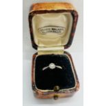 An illusion set diamond solitaire ring. Estimated diamond weight 10 points. Stamped "18ct & Pl" to