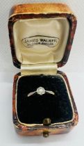 An illusion set diamond solitaire ring. Estimated diamond weight 10 points. Stamped "18ct & Pl" to