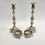 Two silver candlesticks and a pair of silver salts with spoons (all hallmarked)