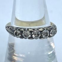 A Victorian graduated five stone Old European cut diamond ring. The central stone measures, face up,