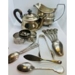 A collection of sterling silver tableware featuring a George III cream jug, marked for H?B, London
