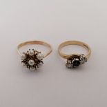 Two dress rings. Comprising a sapphire and diamond trilogy ring, in 9ct yellow gold, marked for