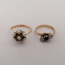 Two dress rings. Comprising a sapphire and diamond trilogy ring, in 9ct yellow gold, marked for