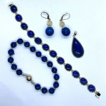 A collection of lapis lazuli jewellery. Featuring a "14k" stamped yellow metal and lapis lazuli