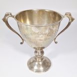A sterling silver two handled cup. Marked for Thomas Fattorini, Birmingham 1926. Engraved "Priory