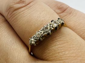 An early 20th century five stone diamond ring. Shank stamped "18ct & Plat". Size P. Estimated