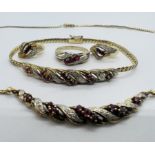 A suite of diamond and ruby jewellery in 9ct yellow gold. Comprising hoop earrings, necklace,