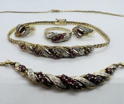 A suite of diamond and ruby jewellery in 9ct yellow gold. Comprising hoop earrings, necklace,