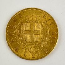 A gold Italian 20 Lira coin. Emanuele II 1873 Approximate weight 6.45 grams Lettering: VITTORIO