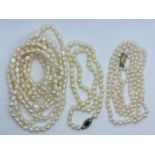 A collection of cultured pearls. Featuring a double strand choker of cream round cultured pearls,