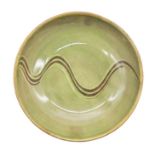 Sidney Tustin for Winchcombe Pottery - A Studio Pottery green glazed bowl with brown swirl design to