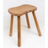 Robert "Mouseman" Thompson of Kilburn - An oak four legged stool, with signature carved mouse to