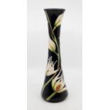 Moorcroft Pottery: A Moorcroft limited edition tall, slender  baluster vase in' Christmas Tulip'